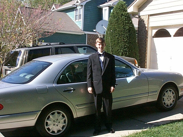 Matt Kelley at prom with a Mercedes from the family dealership